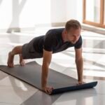 full-shot-young-man-practicing-yoga-indoor